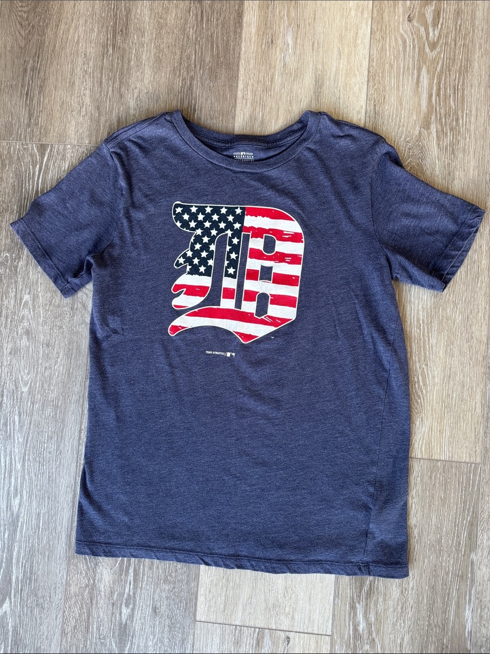 Genuine Merchandise Navy Tee with American Flag 'D' Graphic
